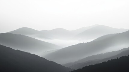Obraz premium Misty hills shrouded in fog, subtle tree line emerging in the background, serene and minimalist landscape evoking tranquility and solitude