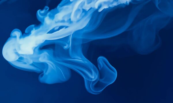 Smoky streaks in icy white on a midnight blue background. Video