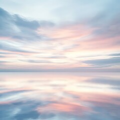 Obraz premium A beautiful sky with pink and blue clouds and a calm ocean