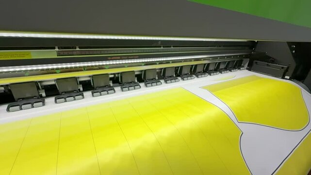 Industrial sublimation printer for digital printing on fabrics. Textile printing is the process of applying color to fabric in definite patterns or designs.and video footage slow motion