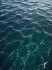 Fototapeta premium The sea’s surface dances with waves, a deep and mysterious blue.