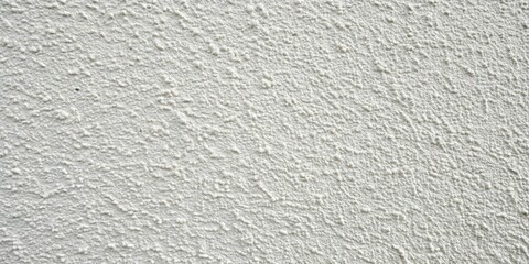 Fototapeta premium White Stucco Wall with a Rough Texture, Featuring a Dense Pattern of Small Bumps and a Subtle Diagonal Grain