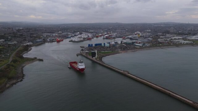 Aerial view of ship leaving Aberdeen harbour, city in scotland.