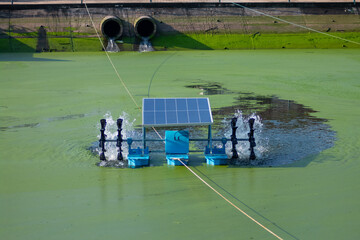 Wastewater treatment using water turbine powered by solar panel front view 