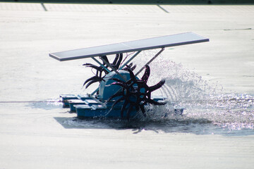Wastewater treatment using water turbine powered by solar panel Side view 