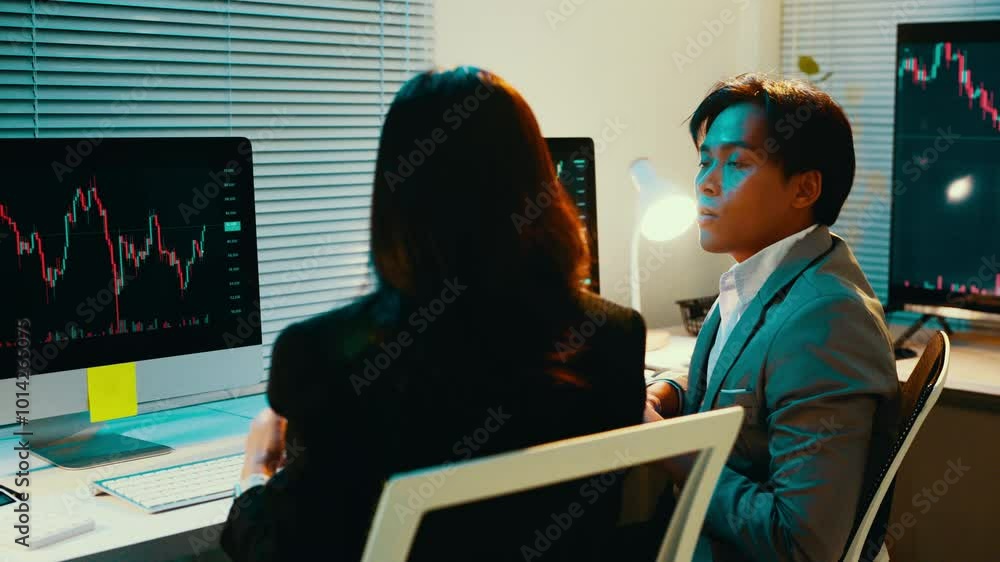 Poster Two stockbrokers are having a discussion about a candlestick chart displayed on a computer screen. The chart shows the volatility of the market