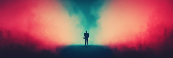 Obraz premium Silhouette of a man standing in a colorful, foggy landscape.