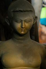 closeup photography of clay idol in Kumartuli