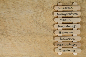 close up of a hand written message on a popsicle stick as a self esteem building concept,...