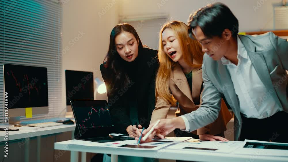 Poster team of business professionals is engaged in a discussion, analyzing financial data and charts on a 