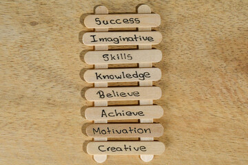 close up of a hand written message on a popsicle stick as a self esteem building concept,...