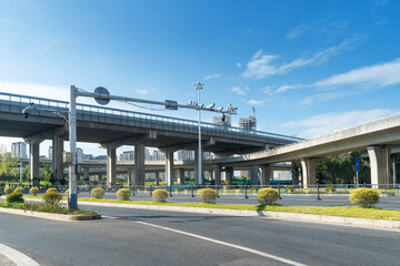 Concrete structure and asphalt road space under the overpass in the city