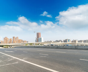 Highway overpass modern city skyline background