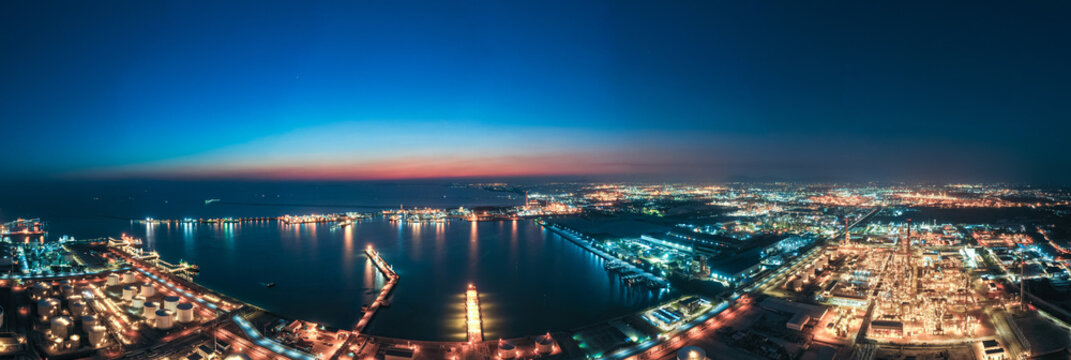 Aerial Industrial city view of white oil tank storage chemical petroleum petrochemical refinery product at oil terminal. Oil terminal storage tank in deep seaport for the international order concept.