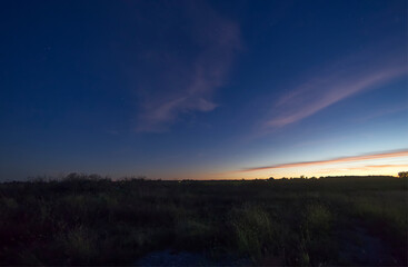 Sunset over a farms field