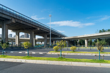 Concrete structure and asphalt road space under the overpass in the city