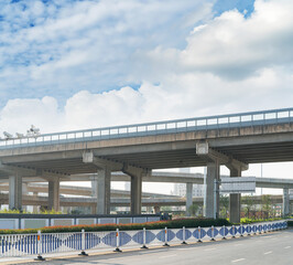 Obraz premium Concrete structure and asphalt road space under the overpass in the city