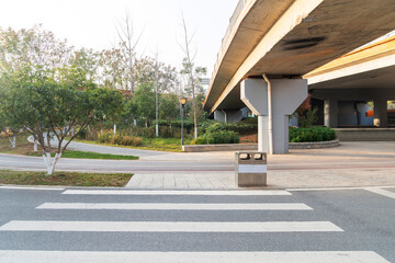 Concrete structure and asphalt road space under the overpass in the city