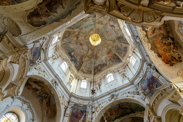 Obraz premium Decoratively painted dome in St Nicholas Church in the Prague in the Czech Republic