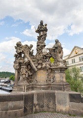 Fototapeta premium Sculpture of Madonna and St Bernard made by Matej Vaclav Jekel on the Charles Bridge on Charles Bridge of Prague in Czech Republic