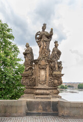 Sculpture of St Barbara St Margaret St Elizabeth made by Ferdinand Maximilian Brokoff on Charles Bridge in Prague in Czech Republic