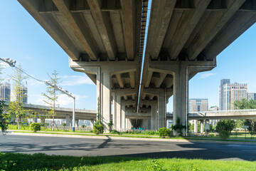 Concrete structure and asphalt road space under the overpass in the city