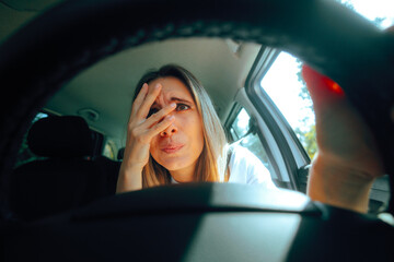 Stressed Driver Feeling Anxious Behind the Wheel Driving. Beginner woman driving for the first time feeling the anxiety 
