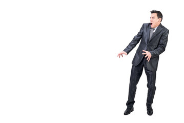 Scared man in suit standing in studio