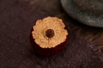 Red dates on wooden tabletop, indoor scene