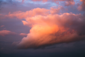An incredible sunset with cumulus clouds glowing in the sunlight.