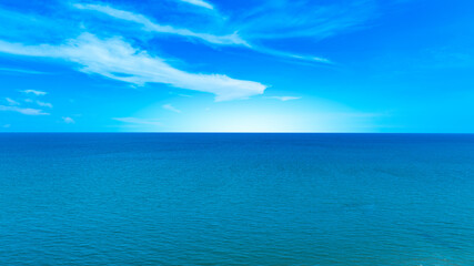 Obraz premium Nature of the beach and sea Summer with sunshine, sandy beaches, clear blue waters sparkling against the blue sky. On an island with good ecology and environment Background for summer vacation concept