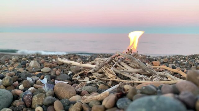 burning candle on the beach