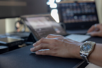 Concept of using technology in communication.Close-up A businessman working on his computer in the office.