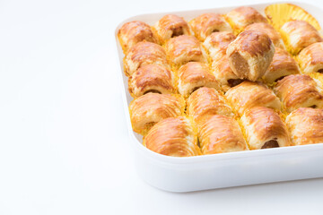 Selective Focus , Pineapple roll tart cookies or Nastar, in a box, isolated on white background.