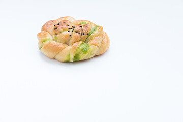 a delicious savory pastry  topped with sesame seeds.  On white background