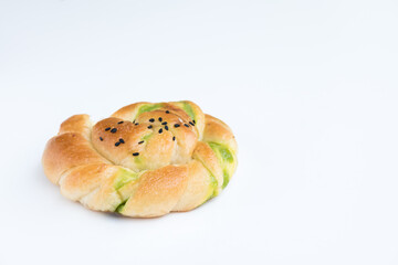 a delicious savory pastry  topped with sesame seeds.  On white background