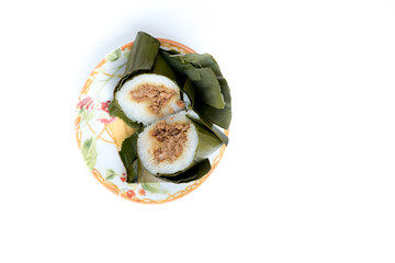 Arem-arem, an Indonesian-Javanese compressed rice cake, filled with minced meat 