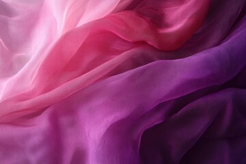 Fototapeta premium Soft and flowing fabric in shades of pink and purple, creating a serene and elegant atmosphere for various creative projects.