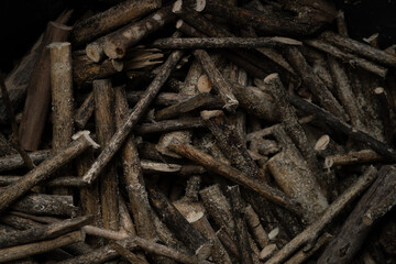 Close of pile of wood preparing for firewood l
