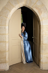 Rococo queen at castle door