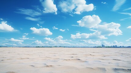 Fototapeta premium A bright blue sky with fluffy clouds casting shadows on the ground