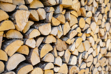 stacked pile of cut fry firewood for winter