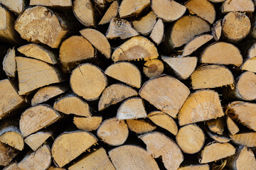 stacked pile of cut fry firewood for winter
