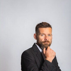 Studio shot of handsome businessman.  Portrait of young businessman in suit.