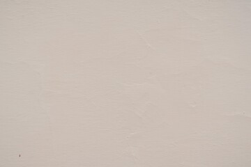 Textured Plaster Wall Background. A close-up of a textured plaster wall with an abstract rough...
