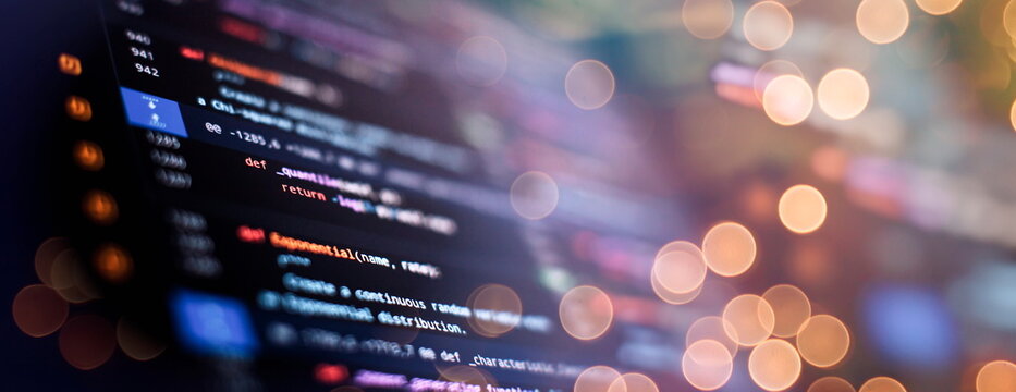 IT business.Monitor closeup of function source code. Project managers work new idea.