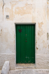 Old authentic vintage closed front door in Ostuni, Puglia, Italy