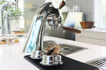 Double coffee portafilter on counter.