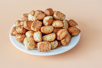 Christmas crisps with poppies in a plate on an orange background