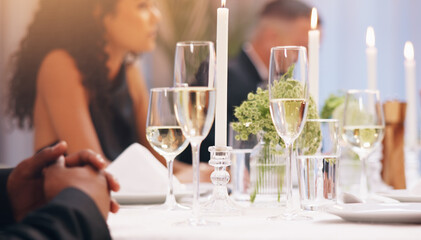 Alcohol, champagne and people at dinner party for celebration, social event and gathering. Glass, luxury and men and women with liquor for cheers, toast and drinks at gala, new years eve or wedding
